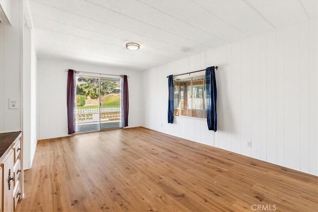 spare room with light wood-style floors