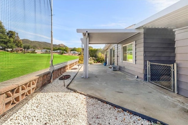 view of patio featuring fence