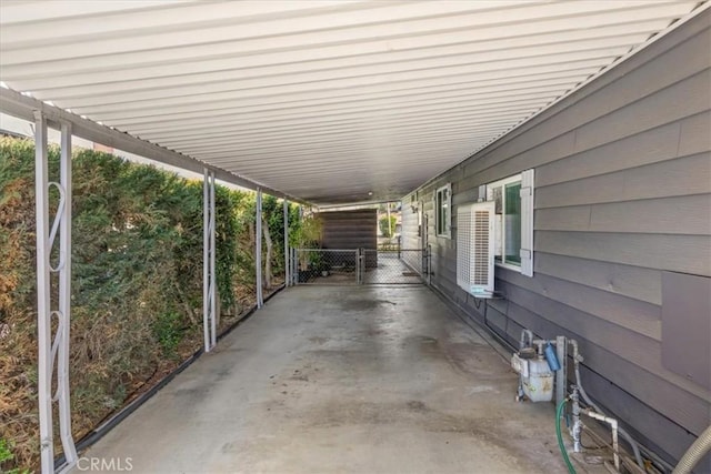 view of patio featuring fence and a gate