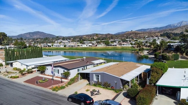 birds eye view of property with a residential view and a water and mountain view