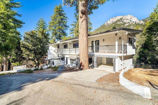 view of front of property with a mountain view