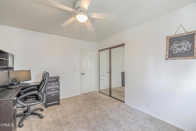 carpeted office with ceiling fan