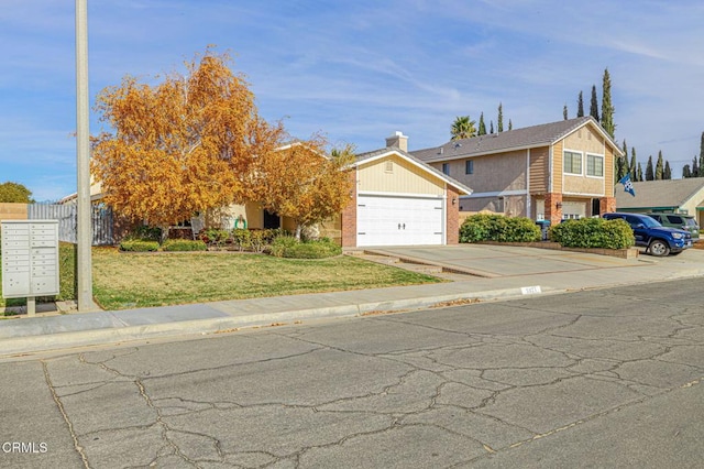 view of front of property with a garage and a front lawn