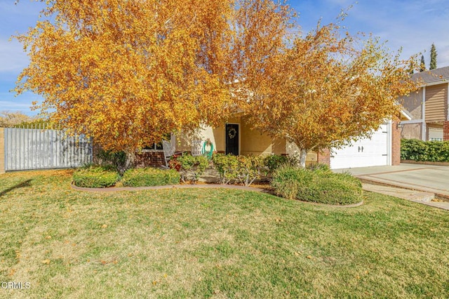 obstructed view of property with a front yard