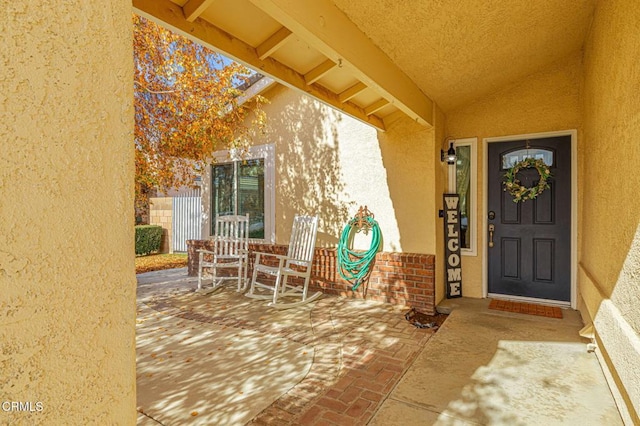 doorway to property with a porch