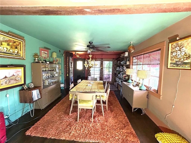 dining room with ceiling fan and dark wood-type flooring