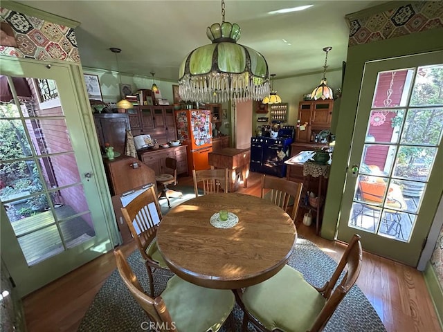 dining area with a chandelier and hardwood / wood-style floors