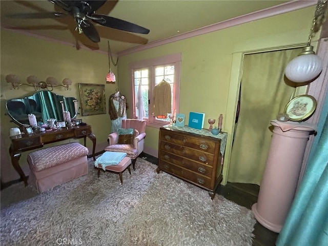 bedroom featuring ceiling fan and ornamental molding