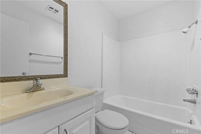 full bathroom featuring toilet, vanity, and  shower combination