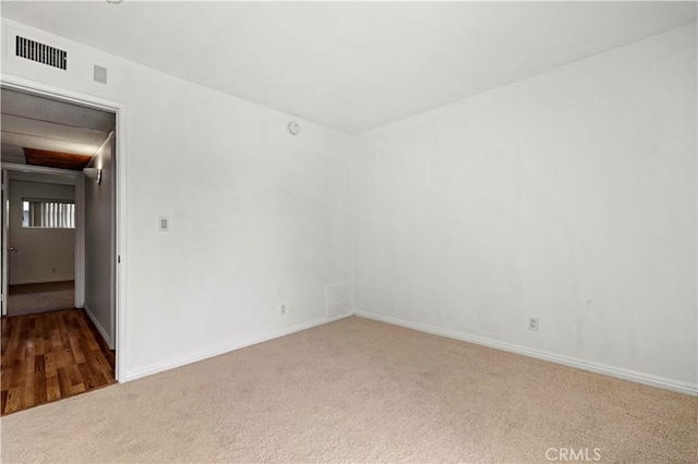 empty room featuring carpet floors