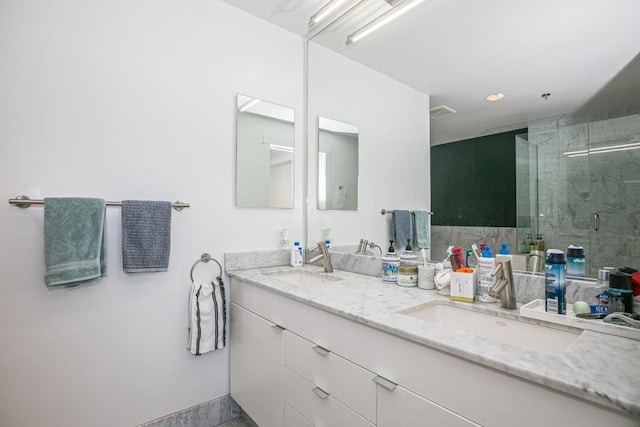 bathroom with vanity and walk in shower