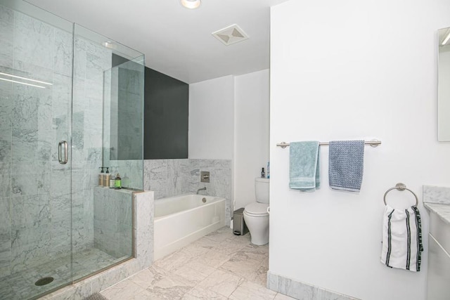 bathroom with toilet and shower with separate bathtub