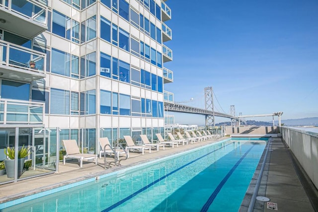 view of pool with a water view