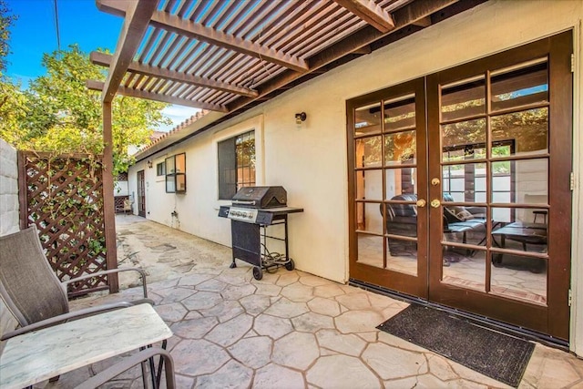 view of patio with a pergola, area for grilling, and french doors