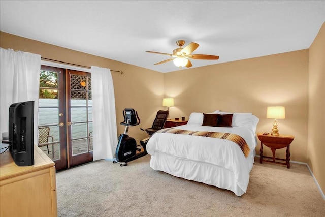 bedroom featuring access to outside, ceiling fan, carpet, and french doors