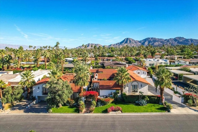 birds eye view of property featuring a mountain view