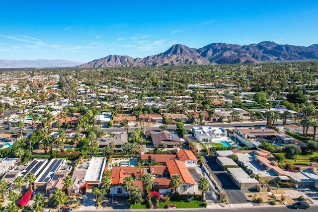 birds eye view of property with a mountain view