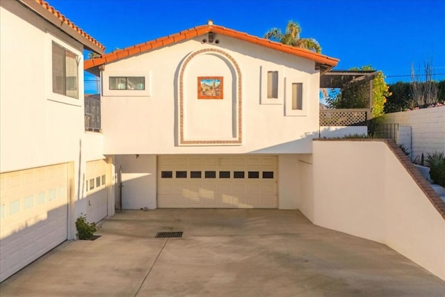 mediterranean / spanish house featuring a garage