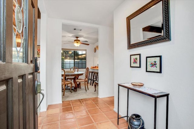 hallway featuring light tile patterned floors