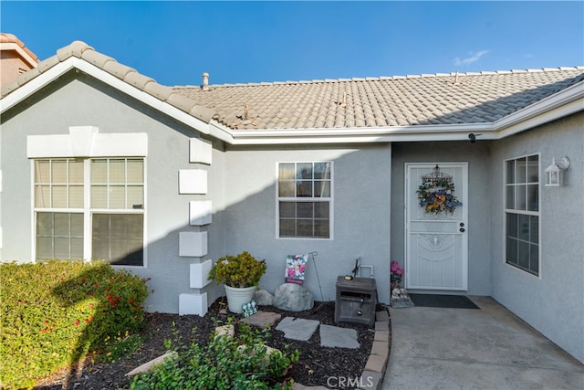 entrance to property with a patio