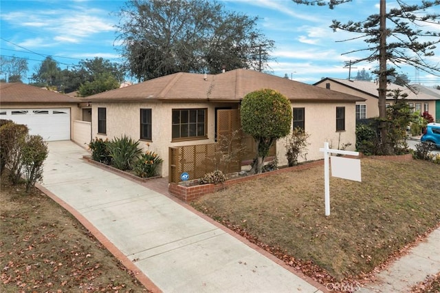 ranch-style house with a front lawn and a garage