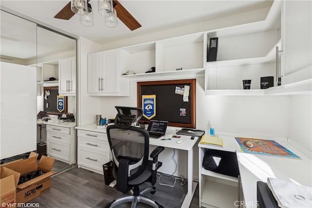 home office with ceiling fan and dark hardwood / wood-style floors