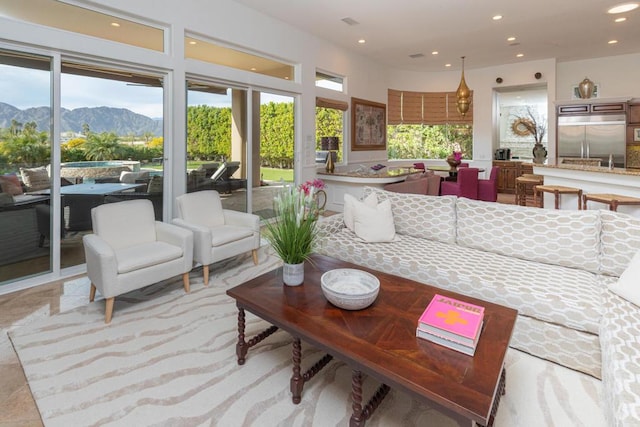 interior space with a wealth of natural light and a mountain view