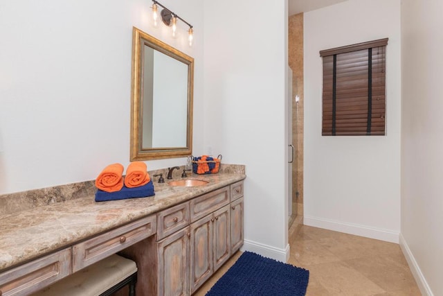 bathroom featuring tile patterned flooring, a shower with shower door, and vanity