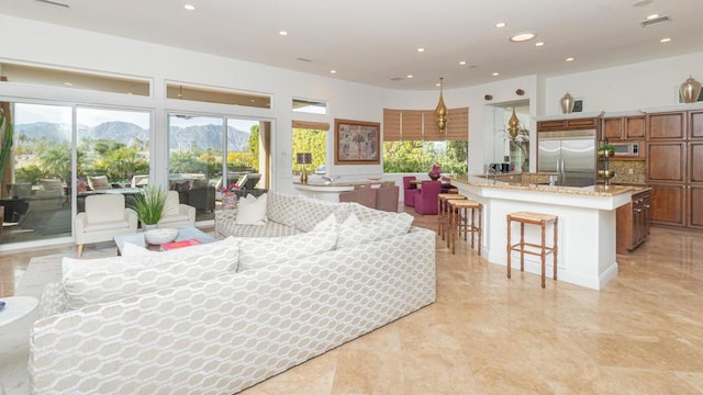 living room with a mountain view and a wealth of natural light