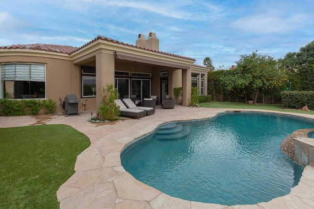 rear view of property featuring a patio