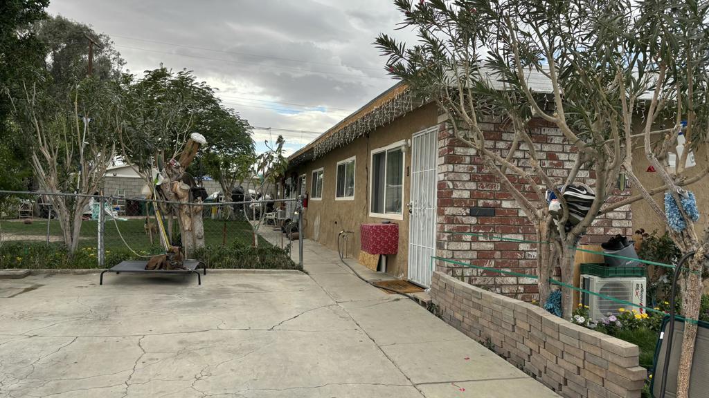 view of side of home with a patio area