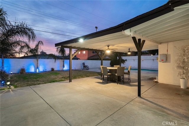 view of patio terrace at dusk