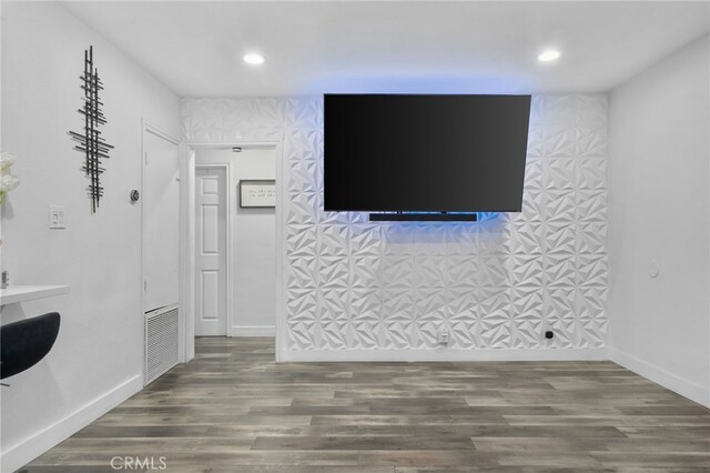 unfurnished living room featuring dark hardwood / wood-style floors