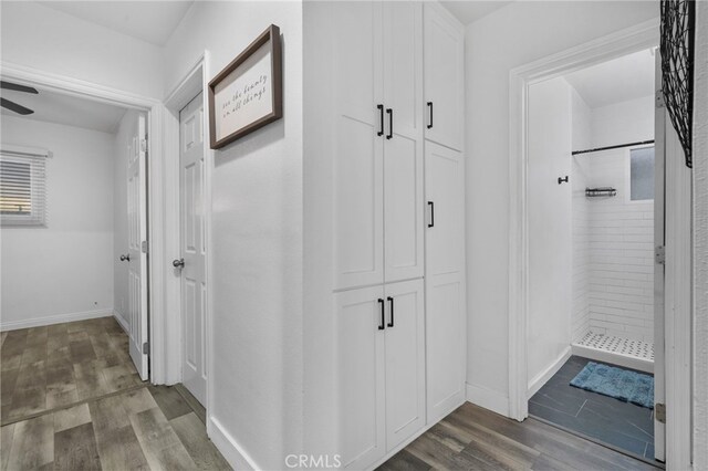 hallway featuring wood-type flooring