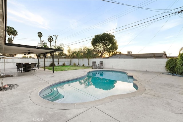 view of pool with ceiling fan and a patio