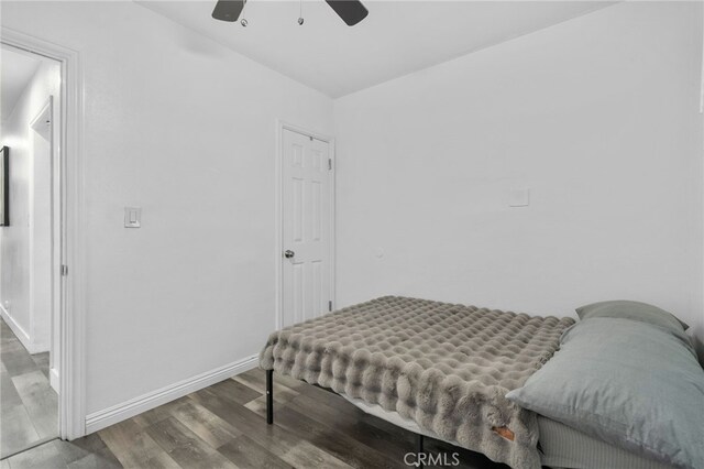 bedroom with ceiling fan and hardwood / wood-style floors