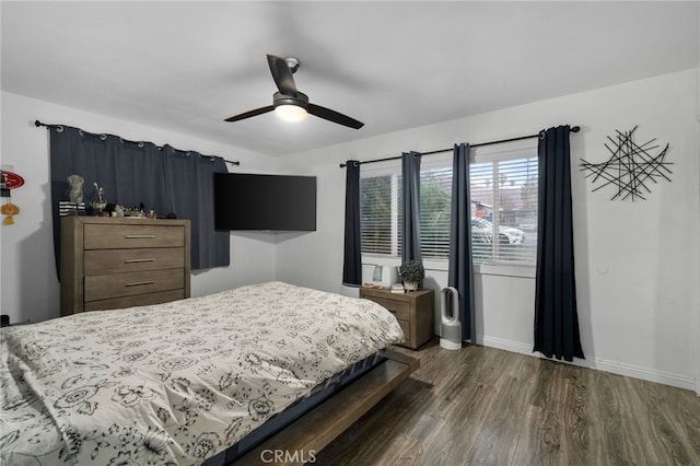 bedroom featuring ceiling fan and dark wood-type flooring