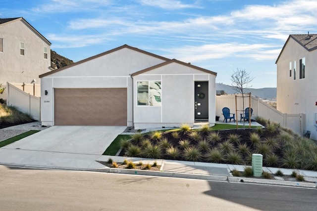 contemporary home featuring a mountain view and a garage