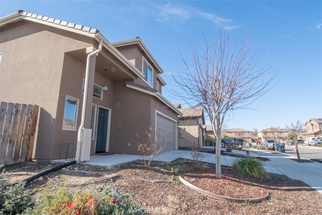 view of property exterior featuring a garage