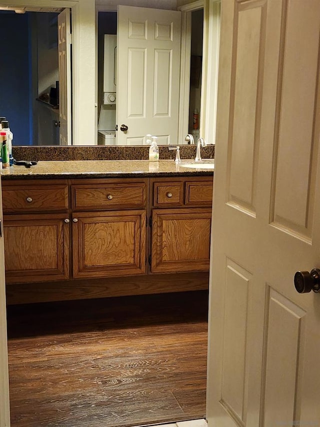 bathroom featuring vanity and hardwood / wood-style flooring