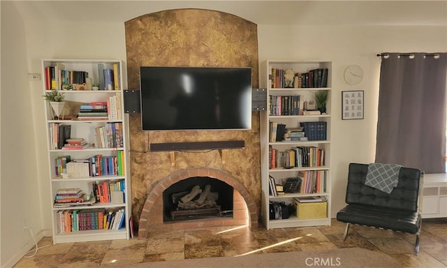 living area with a large fireplace