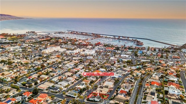 aerial view at dusk with a water view