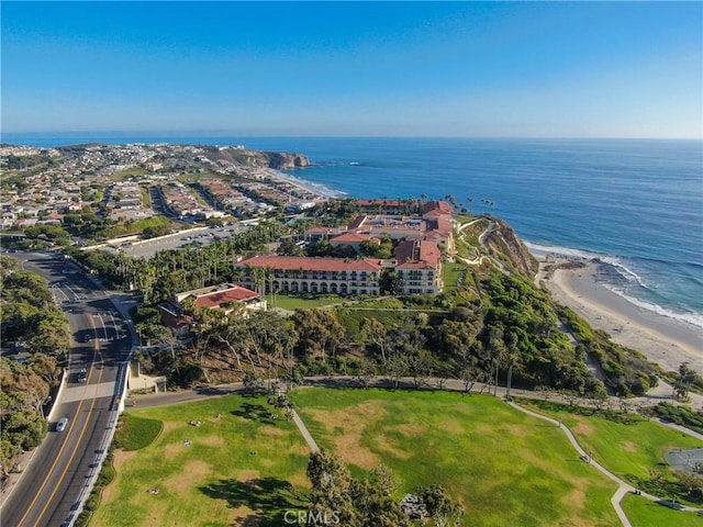 aerial view featuring a water view and a beach view