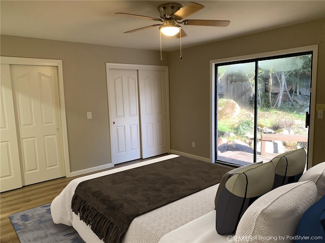 bedroom featuring hardwood / wood-style flooring, access to outside, and ceiling fan