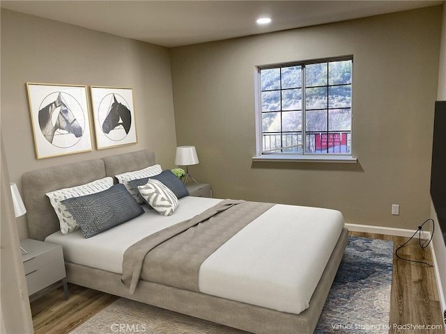 bedroom featuring hardwood / wood-style flooring