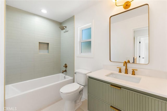 full bathroom with toilet, tiled shower / bath combo, and vanity