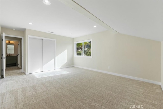 additional living space with light colored carpet