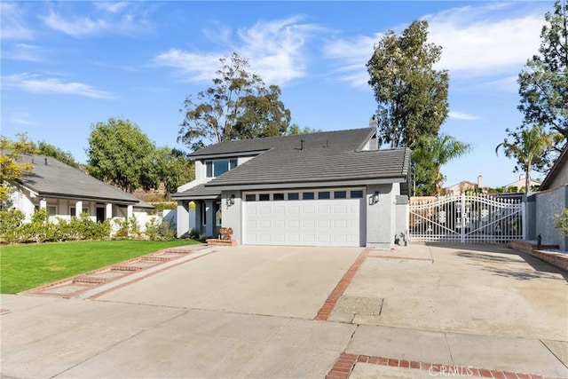 view of property with a front yard and a garage