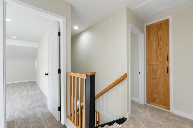 hallway featuring light carpet