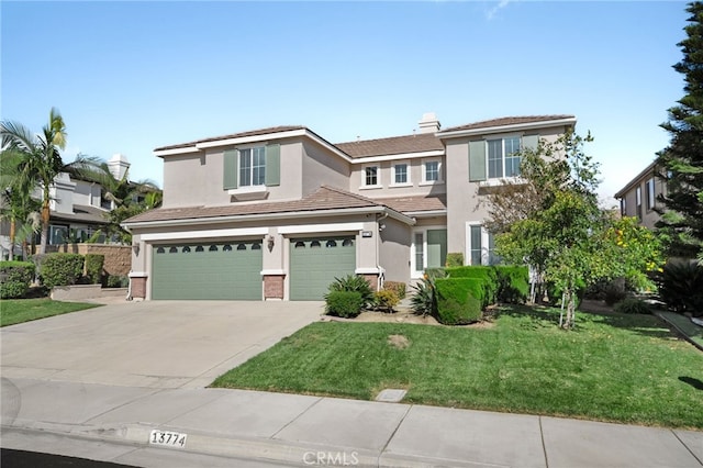 view of front of house with a front lawn and a garage